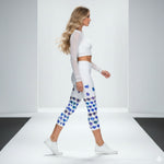 Load image into Gallery viewer, Woman wearing a white long-sleeve crop top and patterned leggings on a plain background
