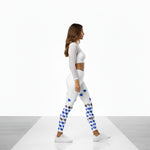 Load image into Gallery viewer, Woman wearing a white long-sleeve top and patterned leggings on a white background
