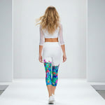 Load image into Gallery viewer, Woman wearing a white outfit with colorful leggings on a white background
