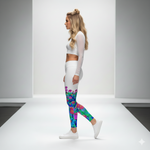 Load image into Gallery viewer, Woman wearing a white long-sleeve top and colorful leggings on a plain background
