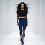 Load image into Gallery viewer, Female model wearing Lunar Legends horse performance capri leggings with blue accents in athletic pickleball outfit walking in modern studio setting
