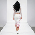 Load image into Gallery viewer, Back view of model wearing Pickleball Love in Full Swing high-waisted capris with heart gradient pattern and UPF 50+ sun protection.
