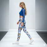 Load image into Gallery viewer, Woman wearing a blue top and patterned leggings walking on a runway.

