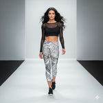 Load image into Gallery viewer, Model walking on a runway wearing a black sheer top and patterned leggings.

