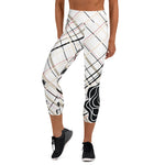 Load image into Gallery viewer, Front view of women's high-waisted tennis capris in beige and black plaid with fuchsia accents and tennis ball print
