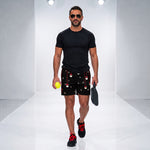Load image into Gallery viewer, Poinsettia Pickleball© Black, Red, Green &amp; White Men's Pickleball Shorts, worn by model | SKYblue Pickleball
