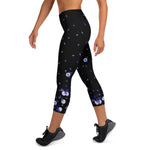 Load image into Gallery viewer, Women's Spring Dink Gradient tennis and padel capris in black with flower and tennis ball print, angled front view
