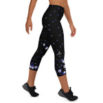 Load image into Gallery viewer, Right side view of women's padel capris in black with Spring Dink Gradient flower print
